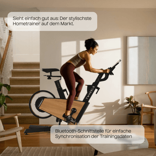 Elegantes TWHEELS Indoor Bike aus Eichenholz mit schwarzem Sattel und Lenker.